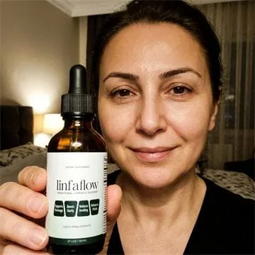 Linfaflow customer photo 2 — a verified buyer holding the 2 fl oz dropper bottle