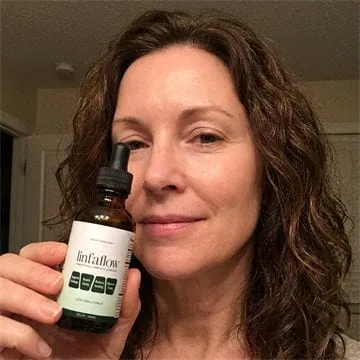 Linfaflow customer photo 4 — a verified buyer holding the 2 fl oz dropper bottle